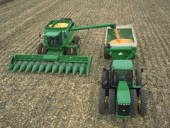 John Deere combine and tractor.