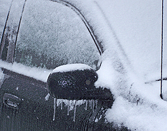 Ice and snow covered car