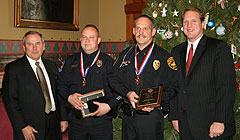 Public Safety Director Gene Meyer, Officers Todd Smith and Steve Klemas, Governor Culver