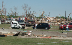 Survivors view destruction left by tornado that hit Parkersburg.