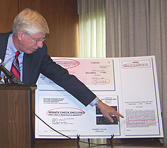 A-G Tom Miller points out letters sent from the Credit Card Protection Agency.