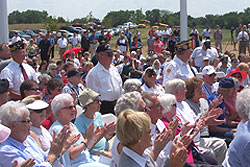 Iowa Navy veterans stand and are recognized during the dedication of the Iowa Veterans Cemetery.