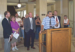 Bill Duncan, owner of the "Two of a Kind" bar in Fort Madison at podium. 