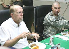 Representative Dave Loebsack (D), has dinner with Sgt. Scott Buss, a native of Hampton, Iowa at Camp Liberty Aug. 14, 2008.