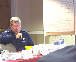 General Ron Dardis listens to discussion during Rebuild Iowa Commission meeting.