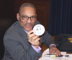 Slayton Thomas shows button from 1992 election.