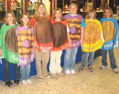 Girl Scouts in cookie costumes.