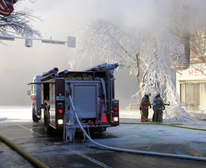 Firefighters at fire in downtown Boone.