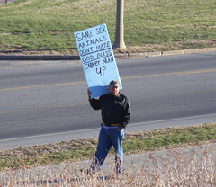 Man protesting gay marriage outside Supreme Court building.