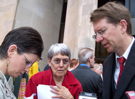 Iowa Family Policy Center director Chuck Hurley talks with supporters at Polk County Administration Building.