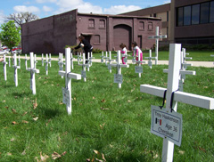 Crosses signify the 65 state employees who died on the job.