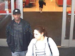 Surveillance photo of couple sought in central Iowa robberies.