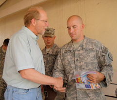 Congressman Dave Loebsack hands out care packages to soldiers.