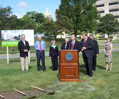 Utilities board chair Robert Berntsen and Governor Culver and other dignitaries break ground for board building.