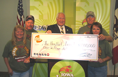 Rick Hamilton and Sharon Sulser of Chariton and Vickie and Terry Chambers of Columbia accept winnings from Lottery CEO Terry Rich.