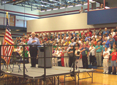 Congressman Boswell leads Pledge of Allegiance at town hall meeting.