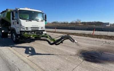 Iowa DOT truck allows one person with a joystick to fill potholes