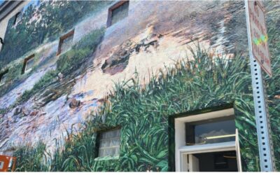 Muralist finishes giant painting of scenic river in northeast Iowa