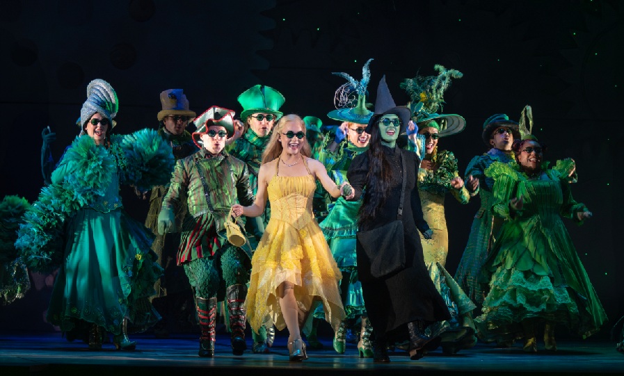 Iowa native is ‘den mother’ for cast and crew of Wicked, and 13 tractor trailers (AUDIO)